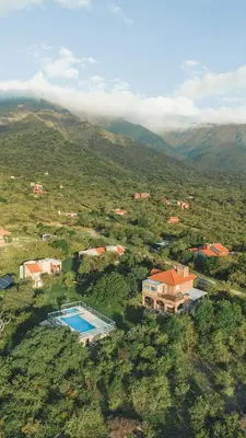 an aerial view of a house and a swimming pool at Algarrobo Nieto in Merlo