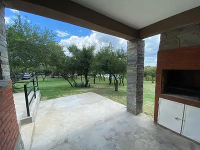 an open patio with a view of a park at Algarrobo Nieto in Merlo