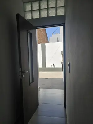 an open door to a room with a window at LitStay Caseros con cochera in Cordoba