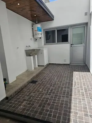 an empty garage with a sink and a counter at LitStay Caseros con cochera in Cordoba