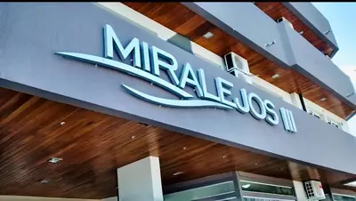 a mahanos sign on the side of a building at Departamento Villa Carlos Paz Miralejos 3 in Villa Carlos Paz