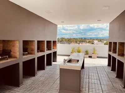 a large bathroom with a tub in the middle of a room at Departamento frente al lago en Villa Carlos Paz in Villa Carlos Paz