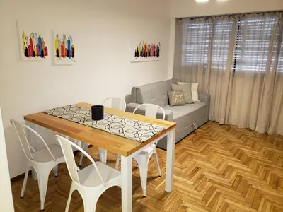 a living room with a table and chairs and a couch at Departamento de Antonia in Cordoba