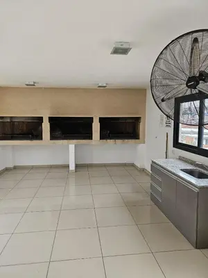 a large room with a kitchen with a fan at Apartamento Esquiu C in Villa Carlos Paz