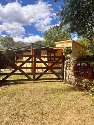 a wooden fence with a sign in front of a building at Architerra in San Javier