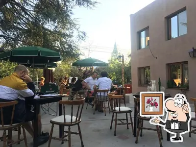 a group of people sitting at tables at a restaurant at Architerra in San Javier