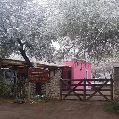 a pink building with a fence in front of it at Architerra in San Javier
