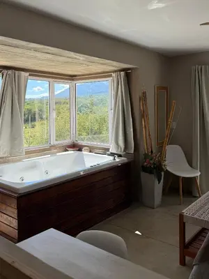 a large bath tub in a room with a window at SOLSALI Cabaña moderna in San Javier
