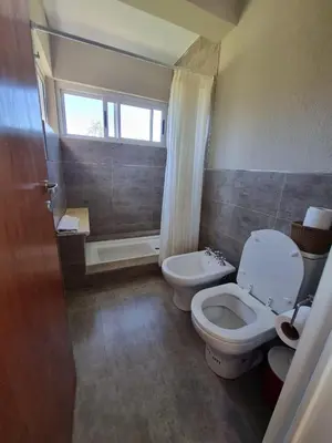 a bathroom with a toilet and a sink and a shower at SOLSALI Cabaña moderna in San Javier