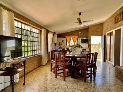 a dining room with a table and chairs at La Casa de Tita in Villa Carlos Paz