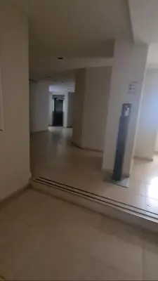 an empty room with a hallway in a building at Departamento Alberdi Completo con Cochera in Cordoba