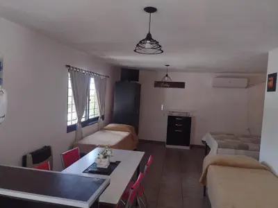a small living room with a table and a couch at Los Ceibos dpto para 4 personas in Estancia Vieja