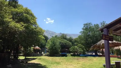 a view of a park with mountains in the background at Complejo Las Violetas in Merlo