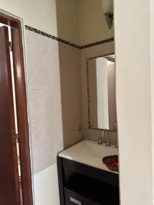 a bathroom with a sink and a mirror at La Morena in Villa Carlos Paz