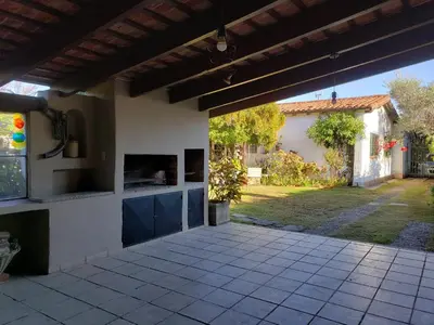 an outdoor kitchen in a house with a yard at CERRO LOFT in Cordoba