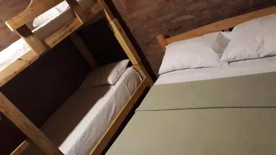 a couple of bunk beds in a room at Cabaña EL ZORZAL de Villa del Dique in Villa del Dique