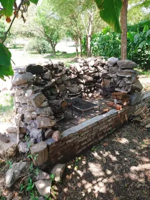 a stone wall with a pile of rocks at Cabaña en Villa General Belgrano in Villa General Belgrano