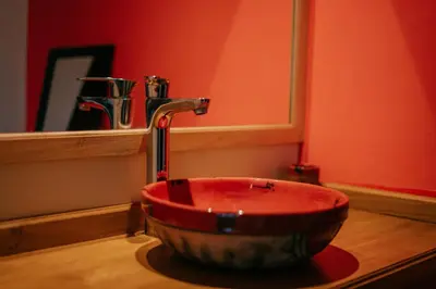 a sink in a bathroom with a faucet at Aires de Sierra in Merlo