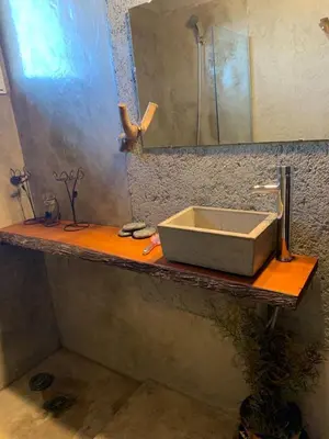 a bathroom counter with a sink and a mirror at Yacanto360 in Villa Yacanto
