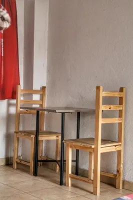 two chairs and a table and a table and chairs at La Vecindad in Cordoba