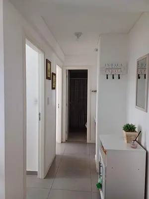 a hallway with white walls and a white hallway with a hallway at Pampa Mora- Estadio Kempes in Cordoba