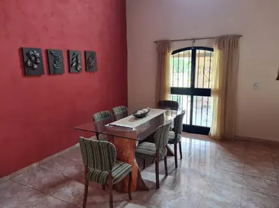 a dining room with a table and chairs at HERMOSA CASA con 4000mts de PARQUE en las SIERRAS DE CORDOBA in José de la Quintana