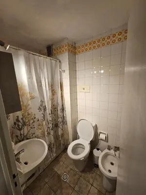 a bathroom with a toilet and a sink at Monoambiente Centro in Cordoba