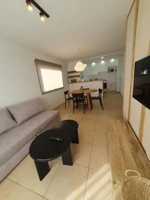 a living room with a couch and a table at Premium appart LOCADOR Nueva Cordoba14C in Cordoba