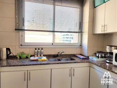 a kitchen counter with a sink and a window at A&A Cordoba Home - Duplex Boutique en Nueva Cordoba in Cordoba
