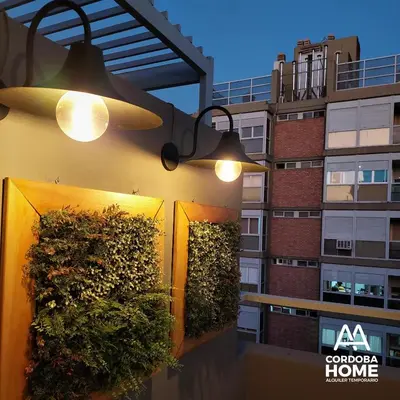 a group of plants on the side of a building at A&A Cordoba Home - Duplex Boutique en Nueva Cordoba in Cordoba