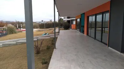 a walkway in front of a building at Complejo Cuatro Colores - Apart Hotel in Potrero de Garay