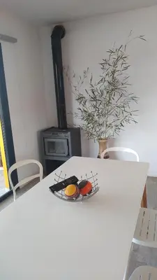 a white table with a plate of food on it at Complejo Cuatro Colores - Apart Hotel in Potrero de Garay