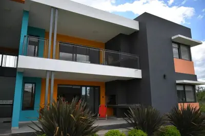 a modern house with a colorful exterior at Complejo Cuatro Colores - Apart Hotel in Potrero de Garay