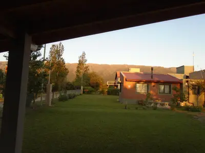 a view of a yard with a house at Álamos de Belén in Carpintería