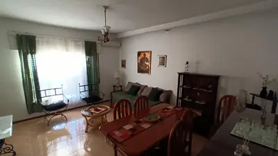 a living room with a couch and a table at DEPARTAMENTO DIARIO PASEO DEL JOCKEY in Cordoba