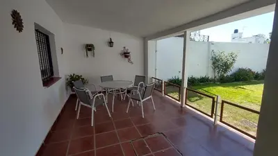 a dining room with a table and chairs on a balcony at DEPARTAMENTO DIARIO PASEO DEL JOCKEY in Cordoba