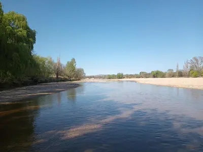 a view of a river with a sandy beach at Luz de las Sierras 2 in Arroyo de Los Patos