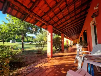 an outdoor patio with awning and tables and chairs at Posada Villapancha B&B in San Javier