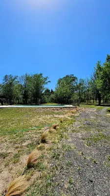 a pile of hay on the ground in a field at CABAÑA DORADA in Villa Ciudad de America