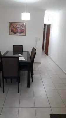 a dining room with a table and chairs at Artigas in Cordoba