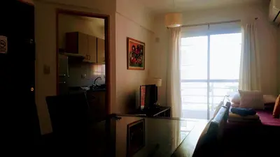 a living room with a couch and a glass table at Artigas in Cordoba