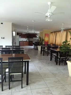 a dining room with tables and chairs in a building at MIRALEJOS33K in Villa Carlos Paz