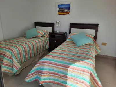 two beds sitting next to each other in a room at Departamento en Nueva Córdoba in Cordoba