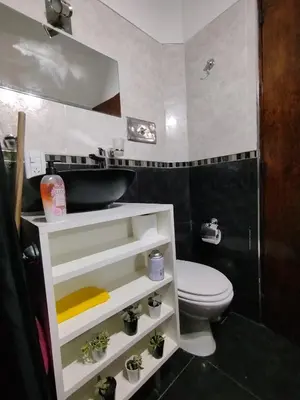 a small bathroom with a sink and a toilet at Chalet 