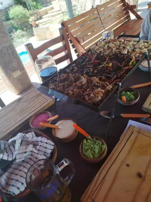 a table with a bunch of food on it at Chalet 