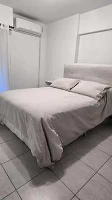a bedroom with a large bed in a room at CHACABUCO 1 dormitorio in Cordoba