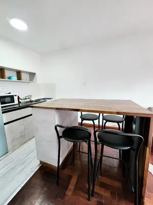 a kitchen with a wooden table and four chairs at DPTO ZONA PATIO OLMOS in Cordoba