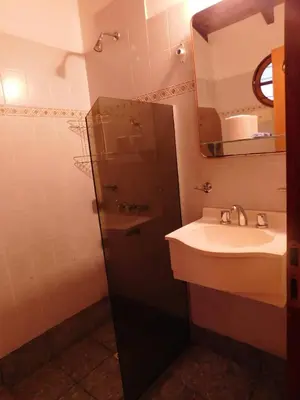 a bathroom with a sink and a mirror at El Agora in Villa General Belgrano