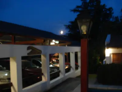 a street light in front of a house at night at El Agora in Villa General Belgrano