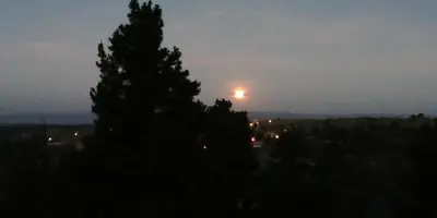 a view of the moon in the sky at night at Hotel Panorama in La Cumbrecita